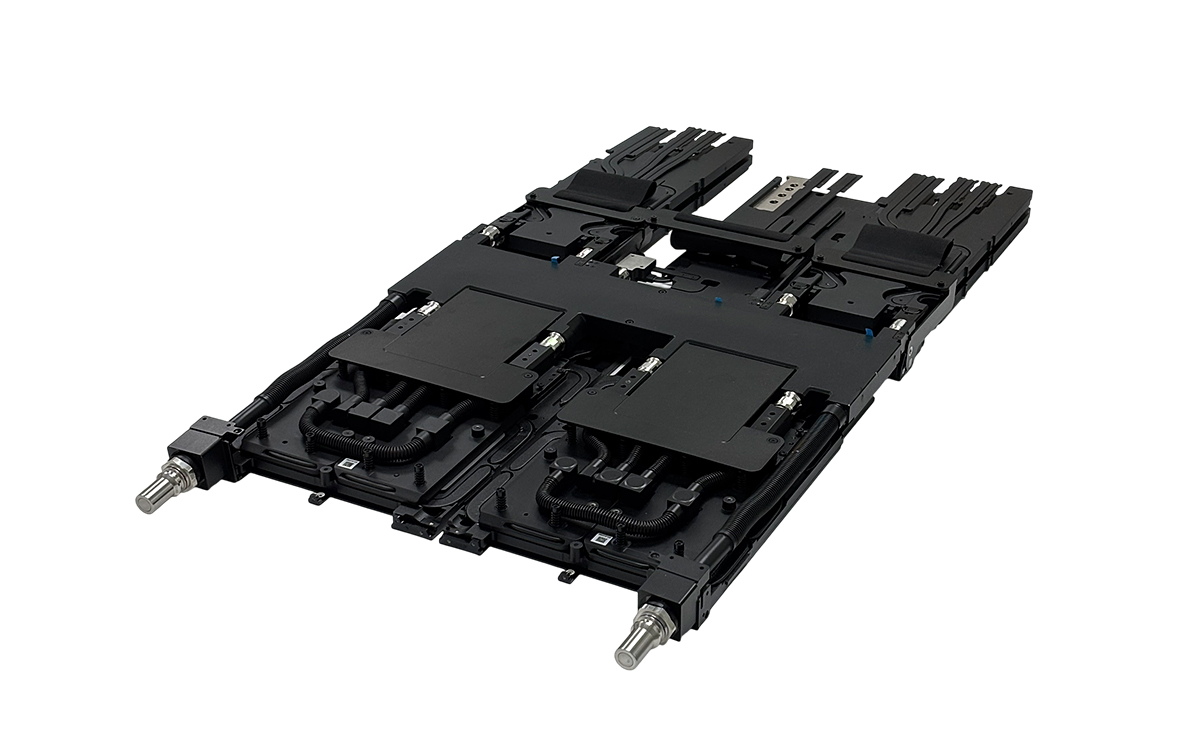 Black multi-channel cold plate assembly with multiple cooling paths and metal connection fittings.